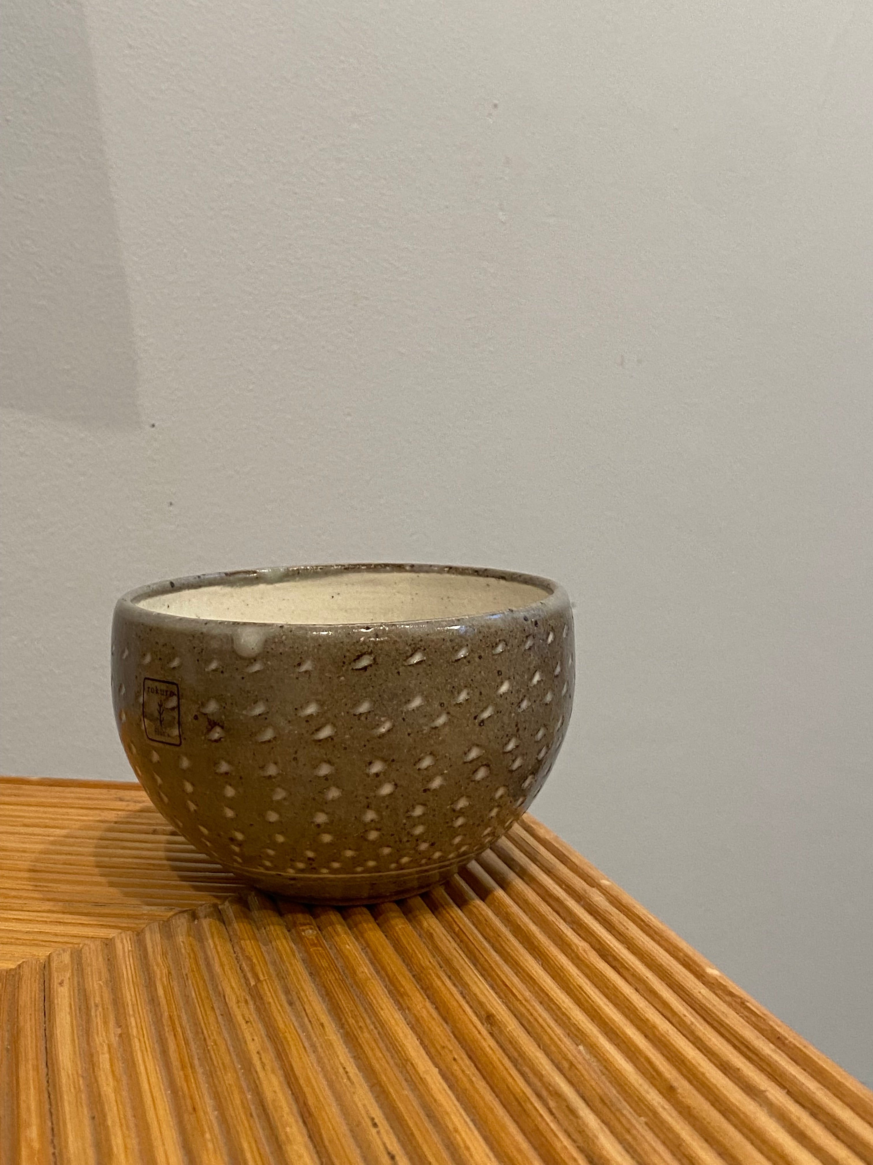 Bowl with gray glaze and white notches