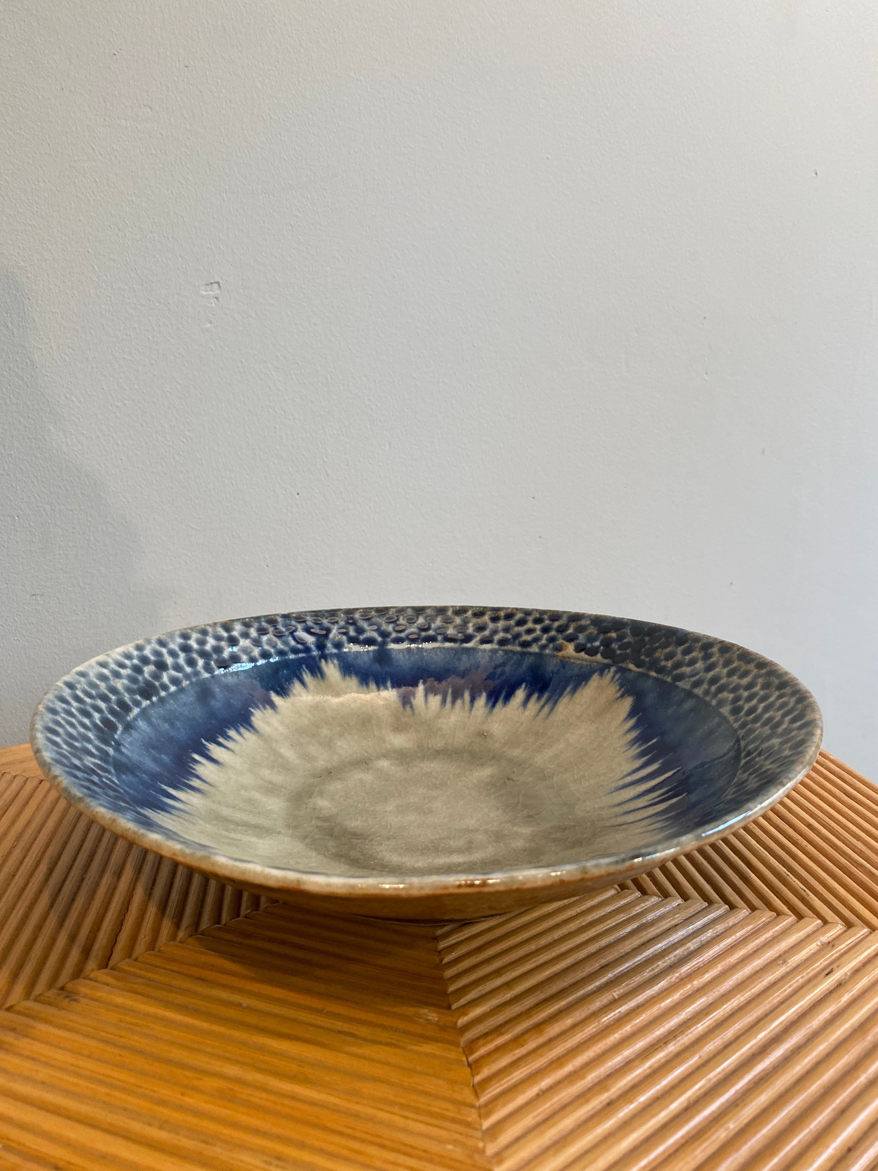 Large dish with greyish glaze and blue dots and details