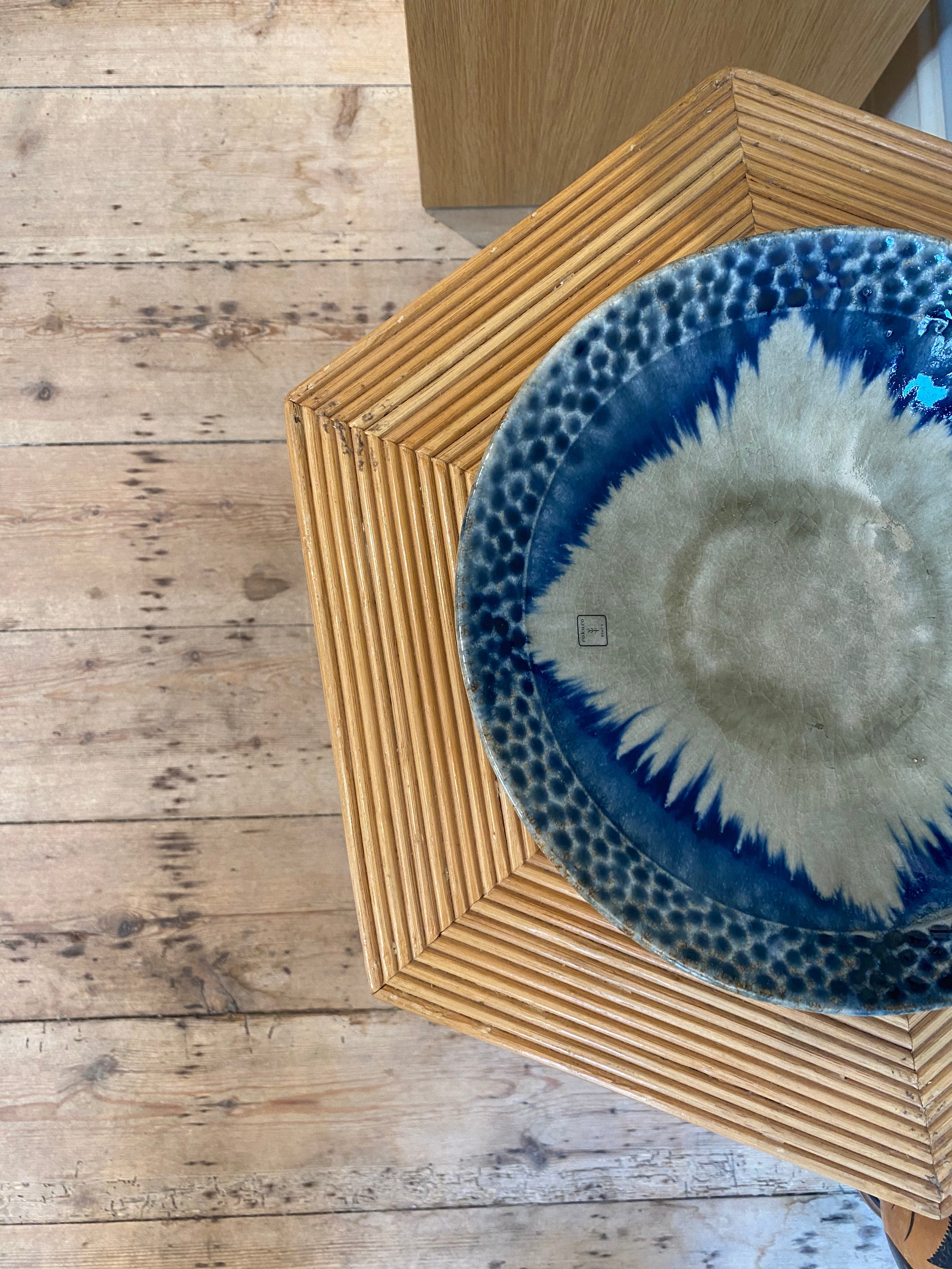 Large dish with greyish glaze and blue dots and details