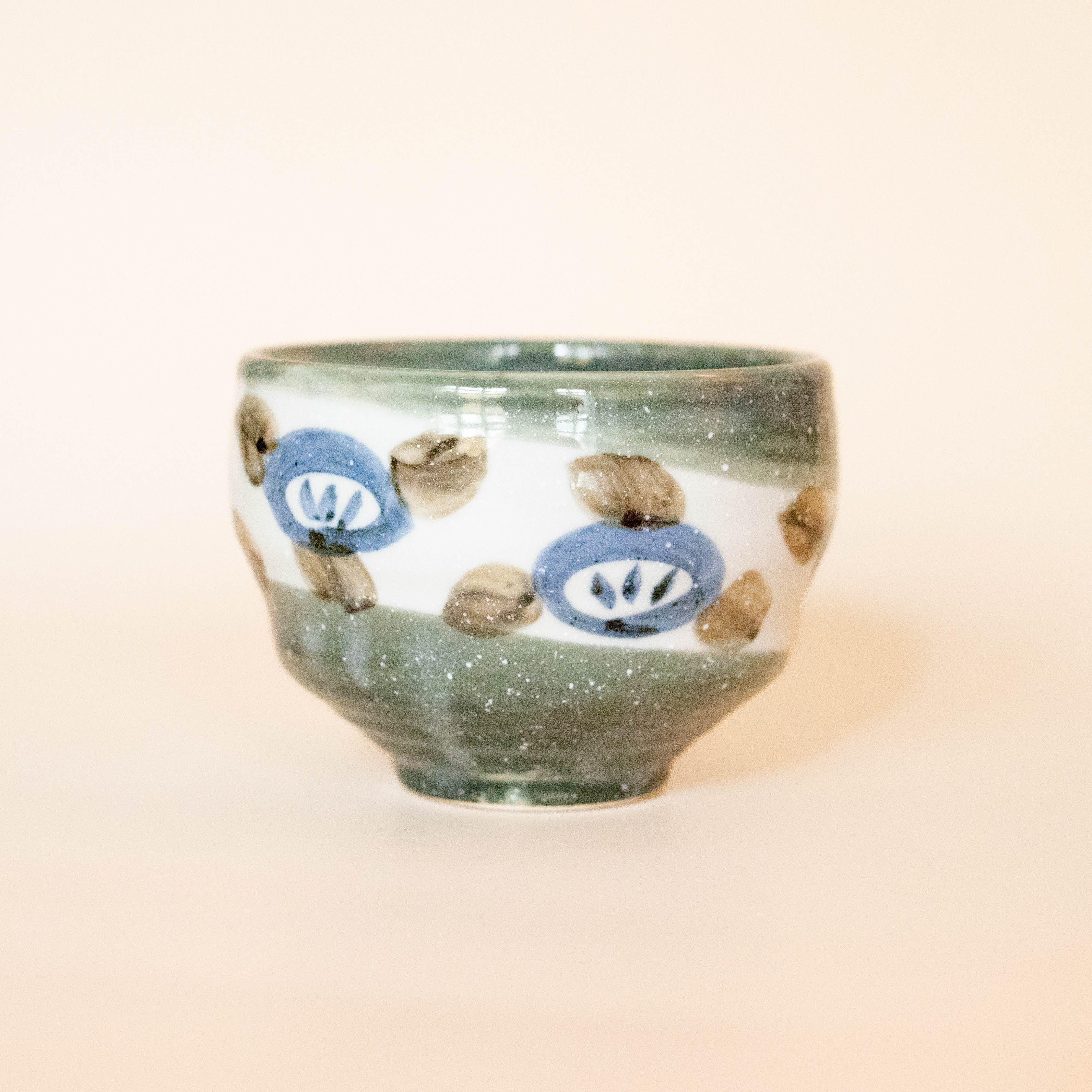 Japanese cup with flowers in blue, brown and gray details