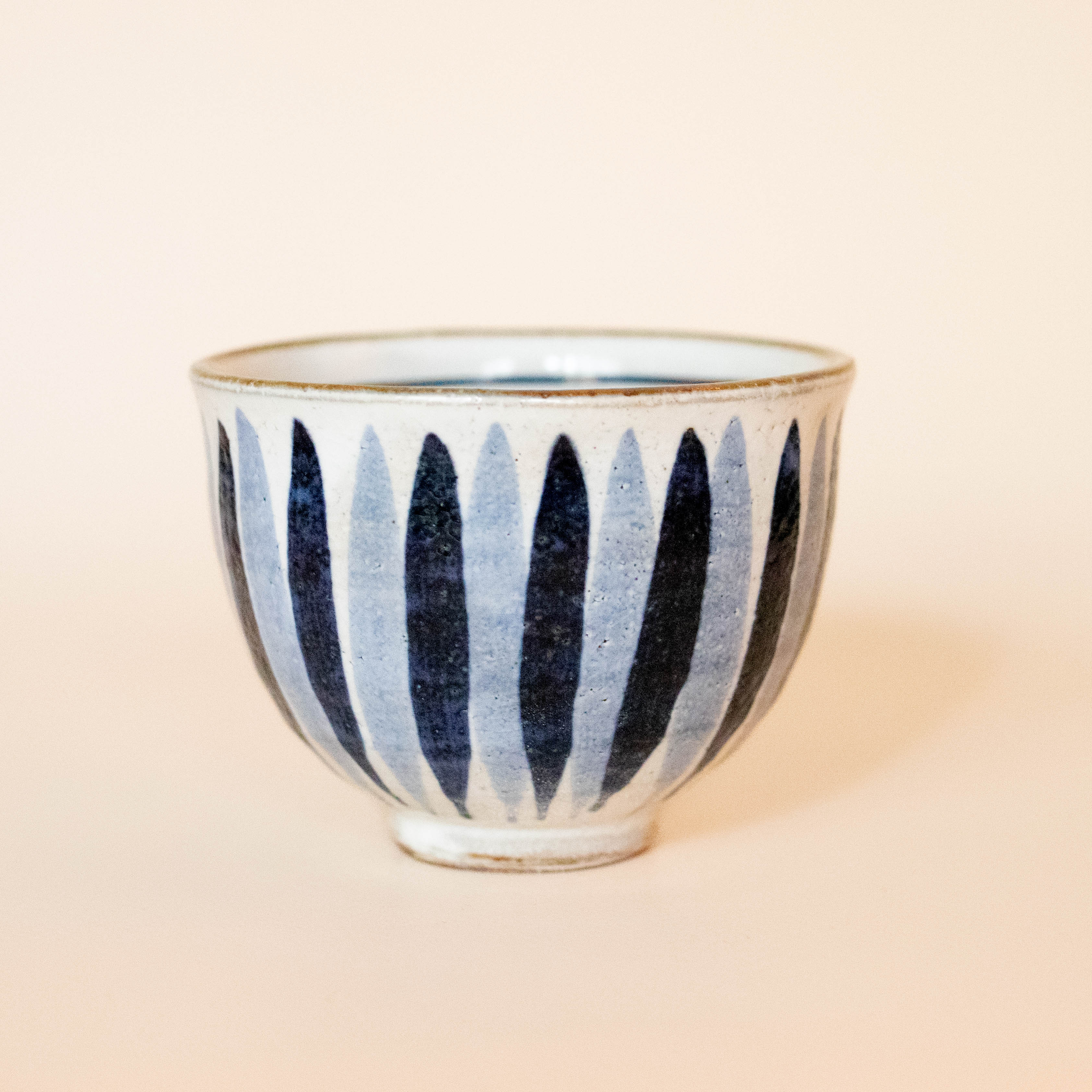 Handmade Japanese cup with blue stripes