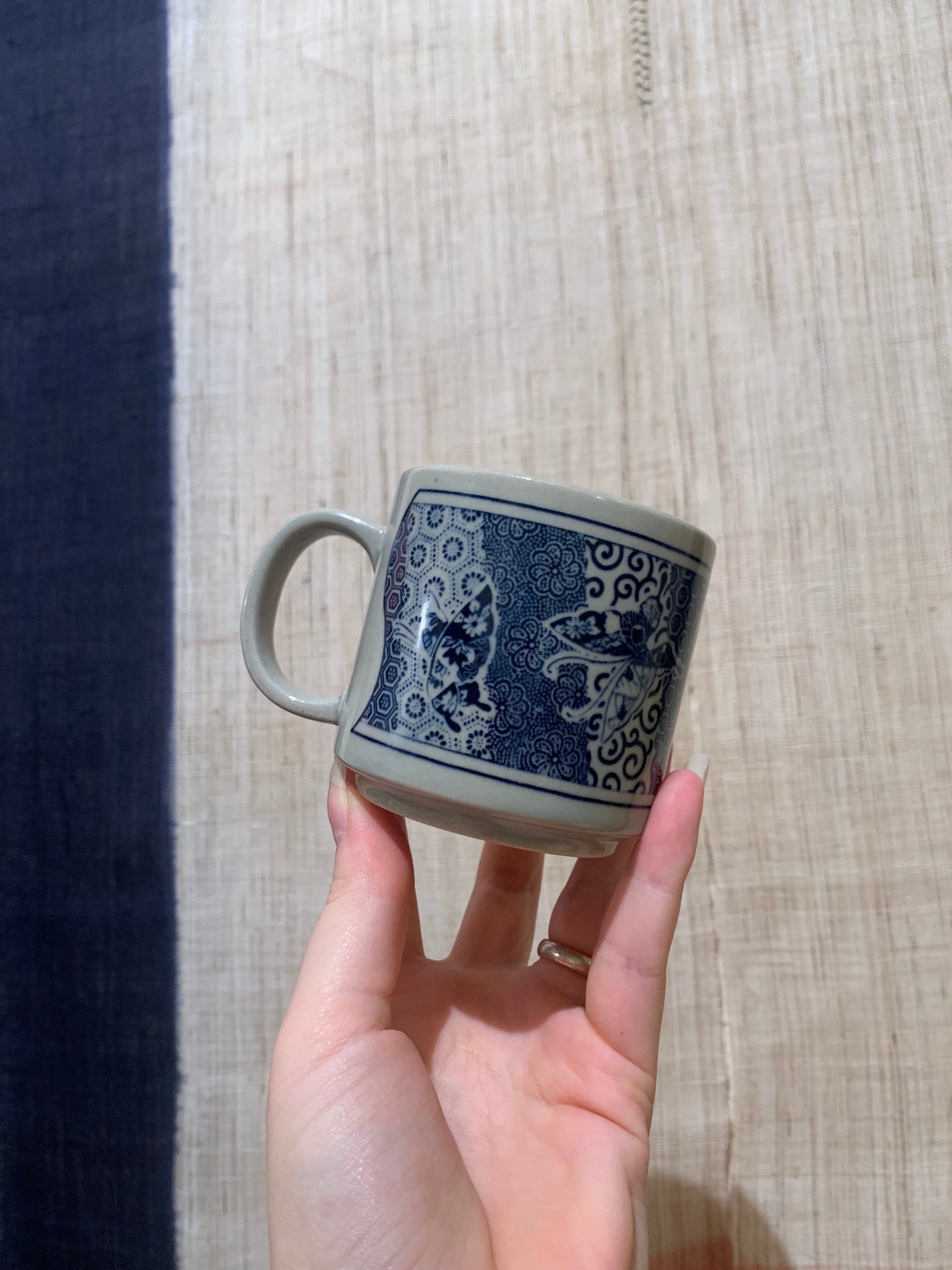 Cup with blue pattern and butterflies