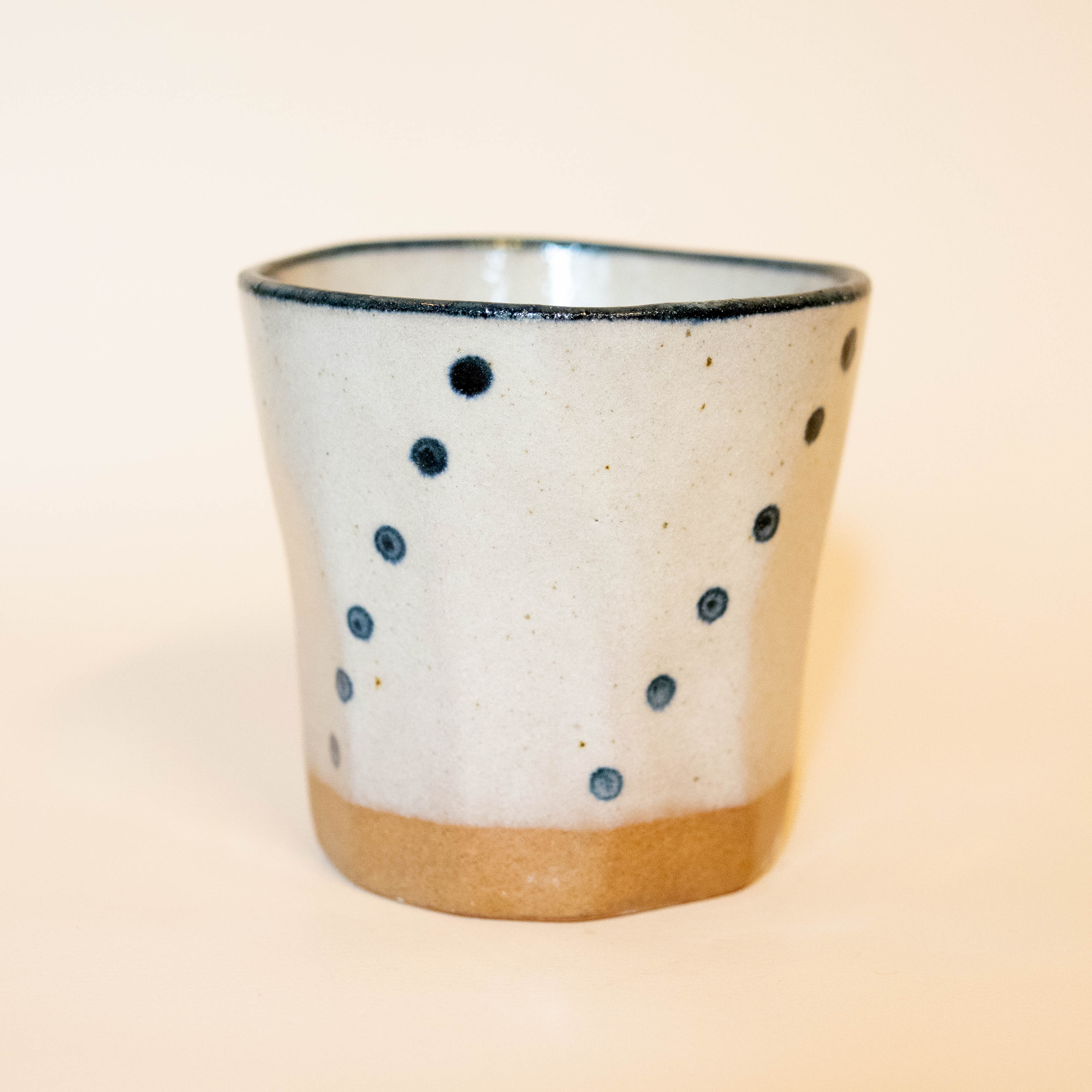 Large mug with beige glaze and blue details