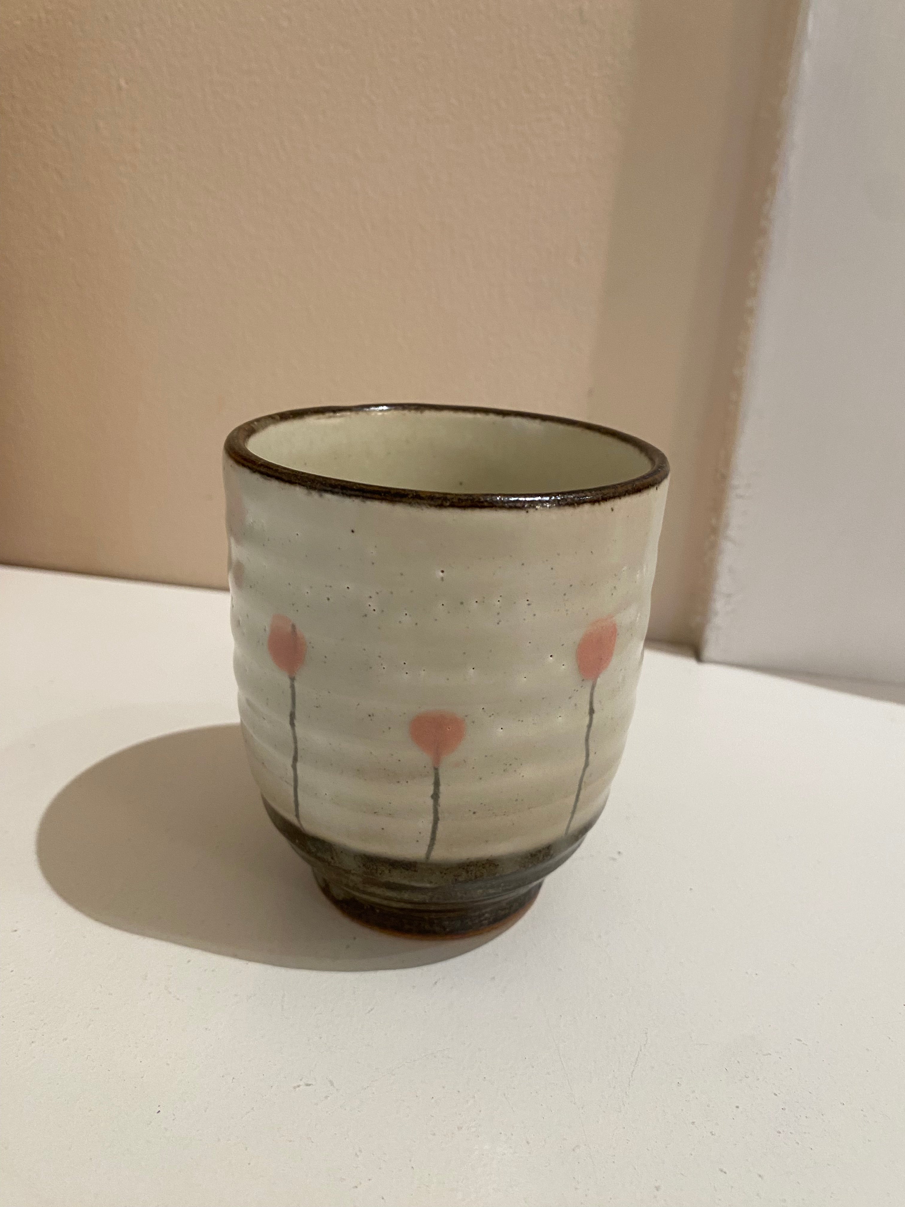 Cup with pink flowers