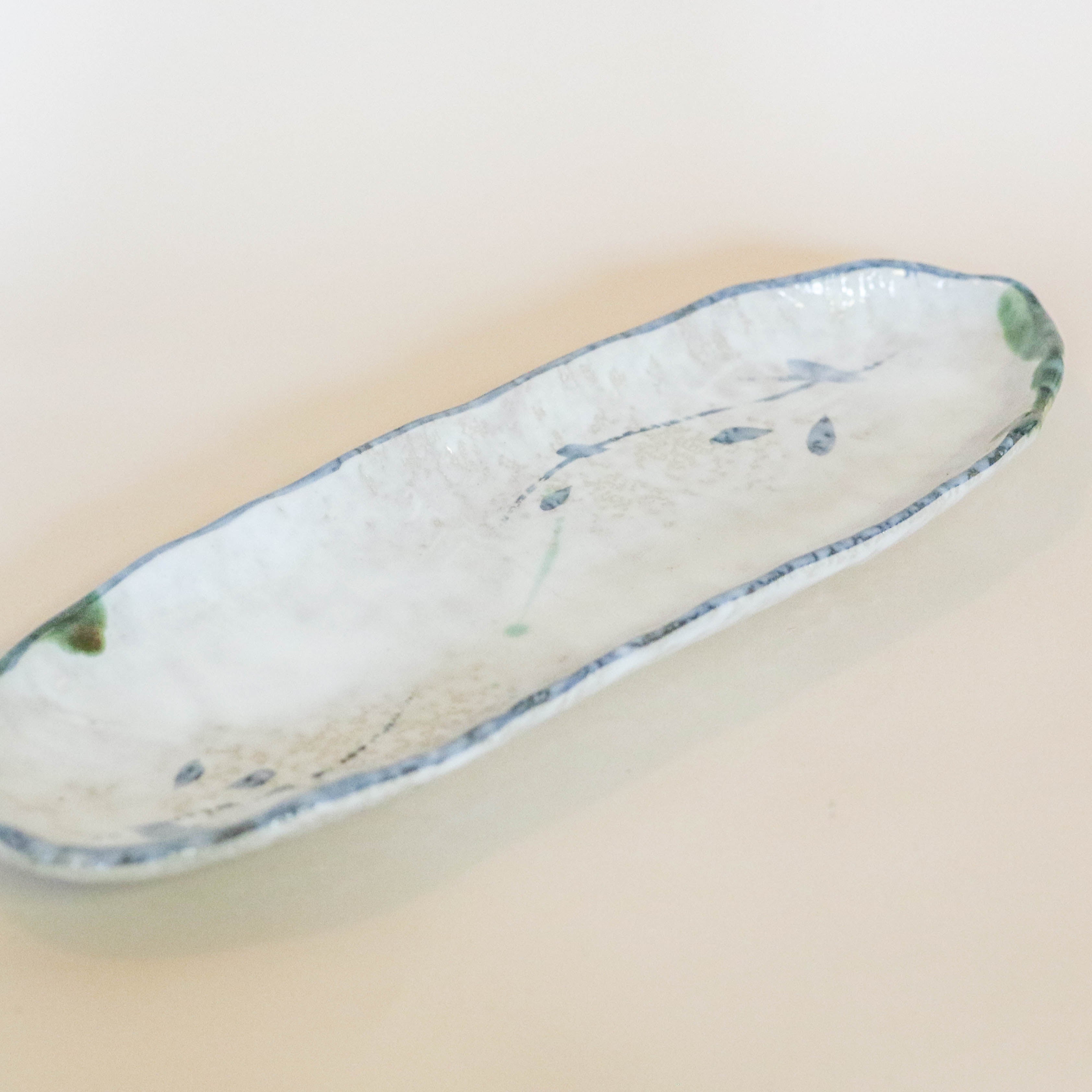 Japanese dish with blue and green pattern, oblong