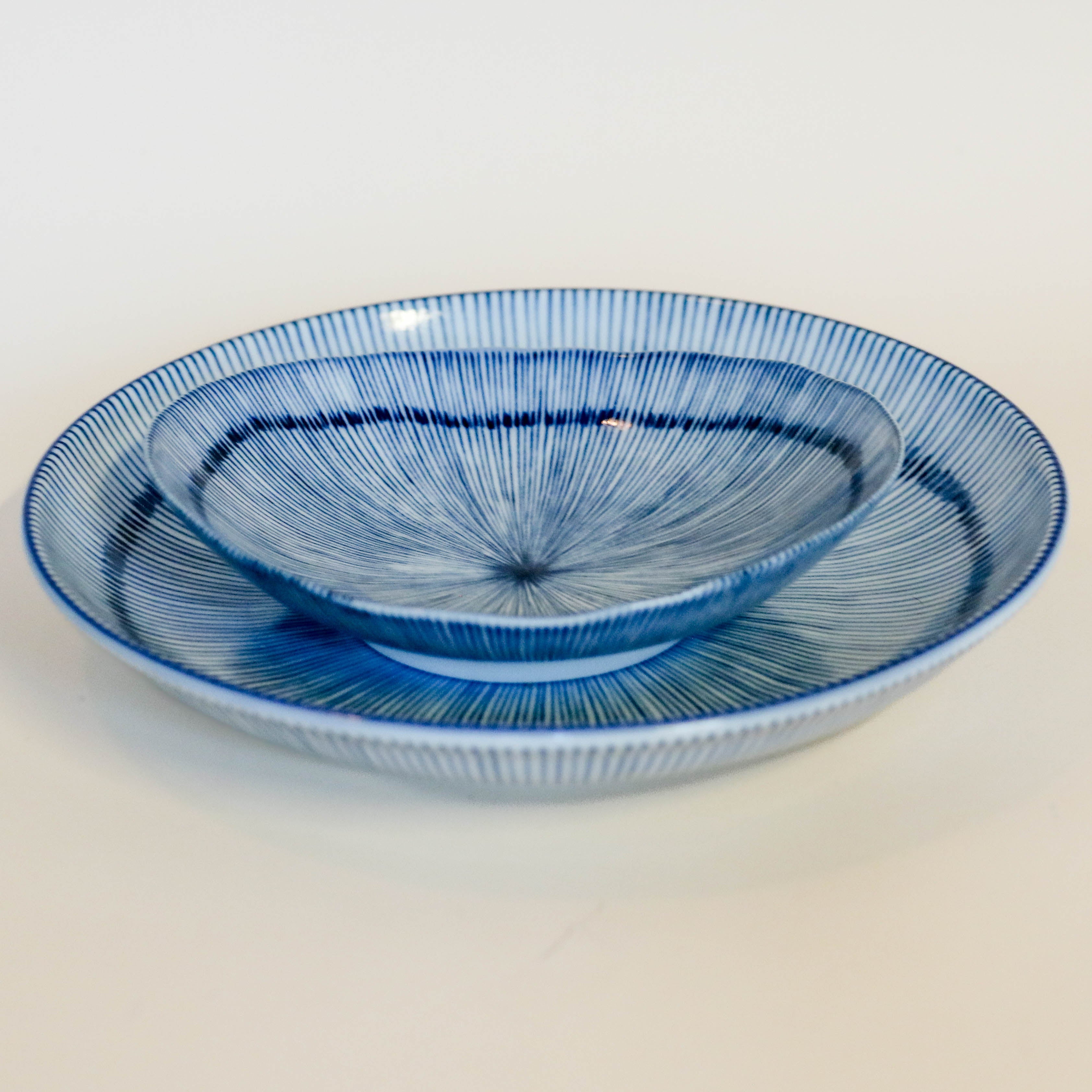 Deep plate/dish with thin blue stripes