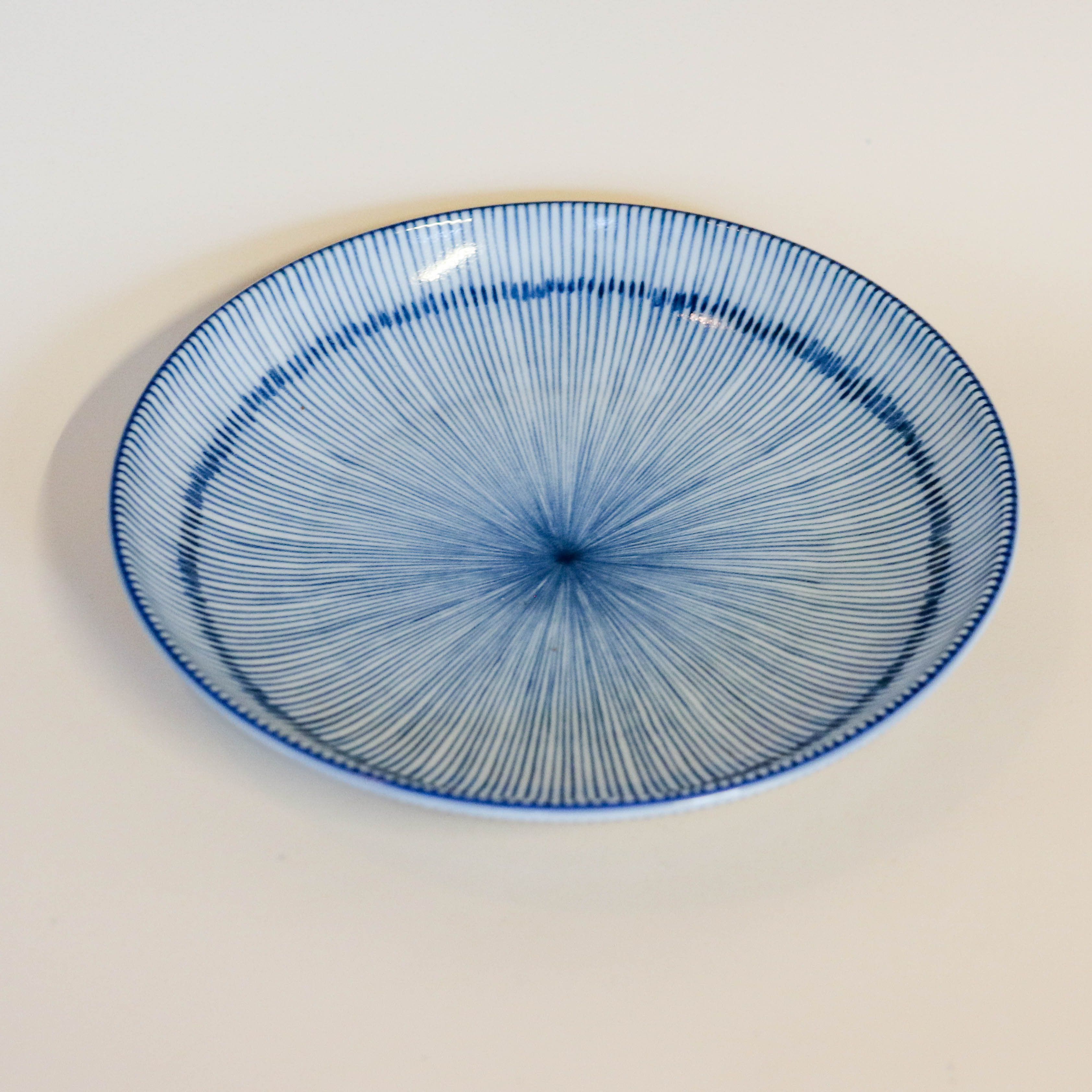 Deep plate/dish with thin blue stripes