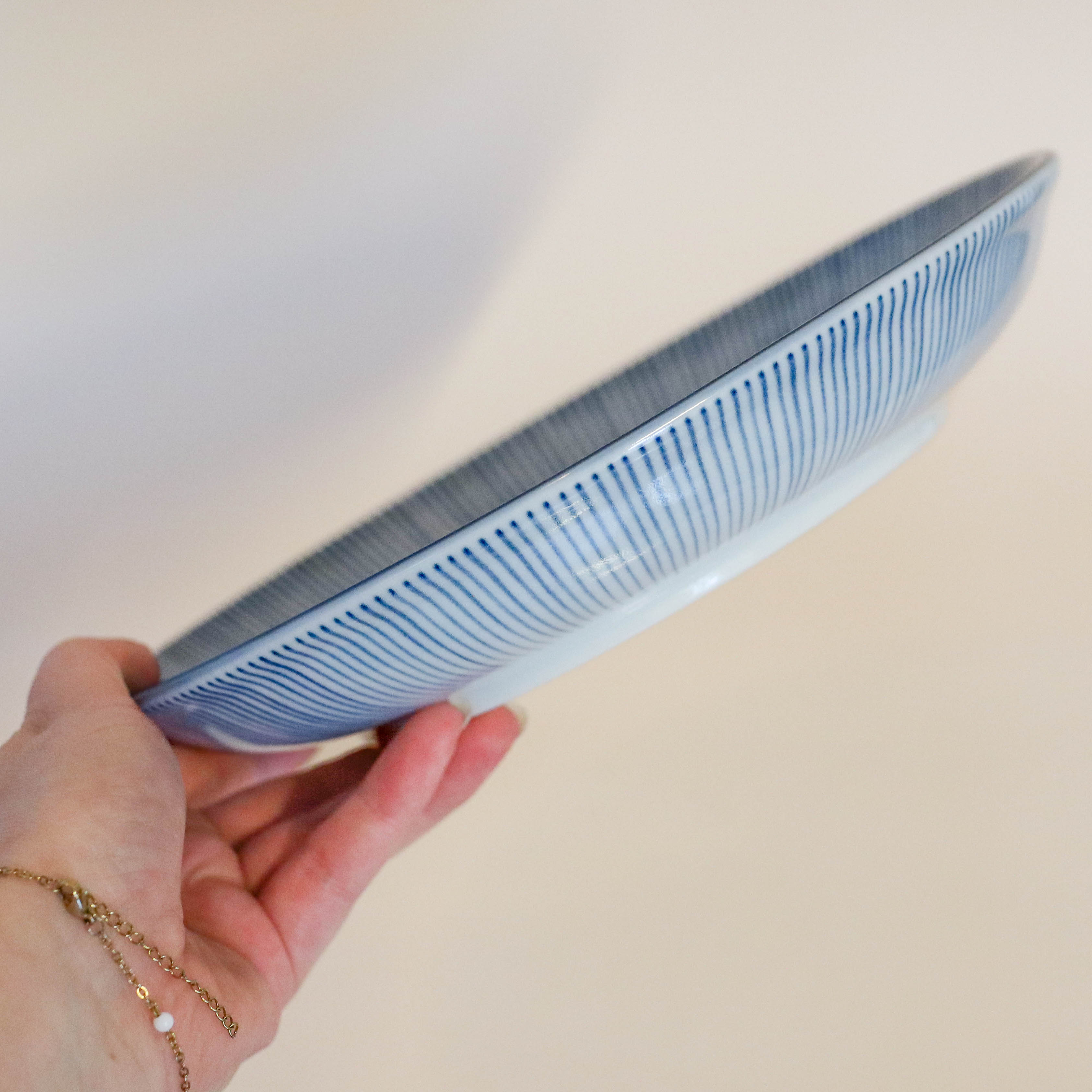 Deep plate/dish with thin blue stripes