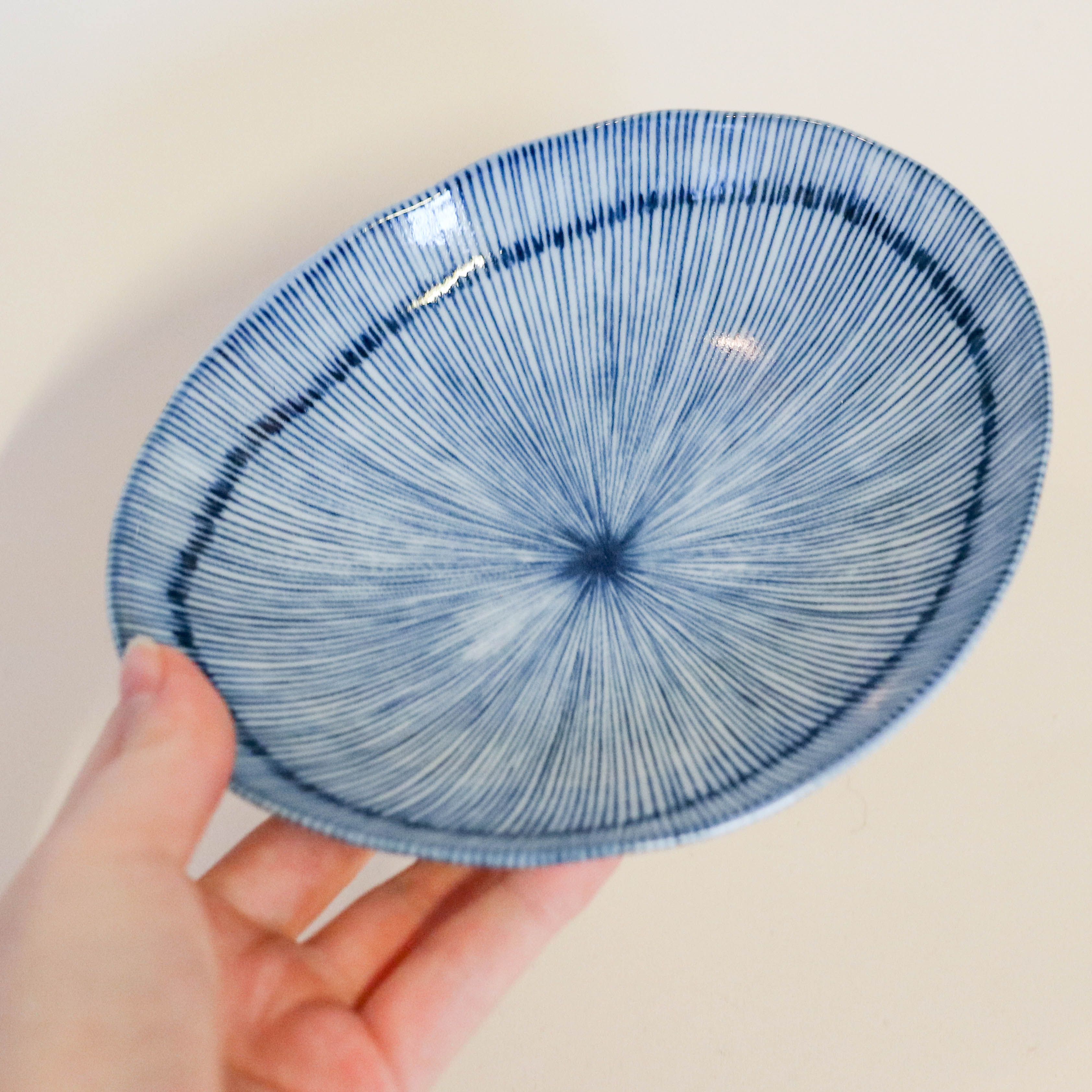 Small flat bowl with blue thin stripes