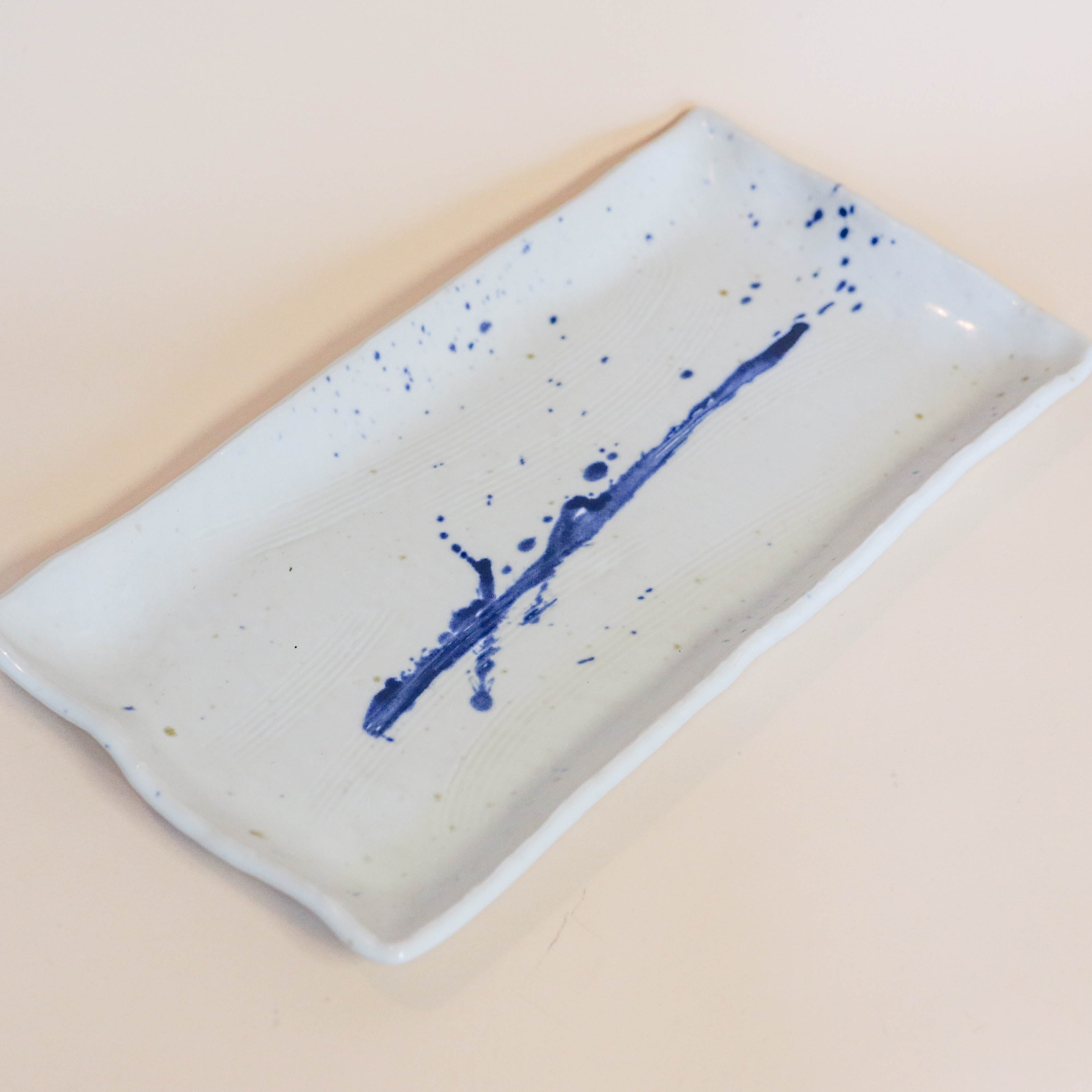 Elongated square dish with blue splash