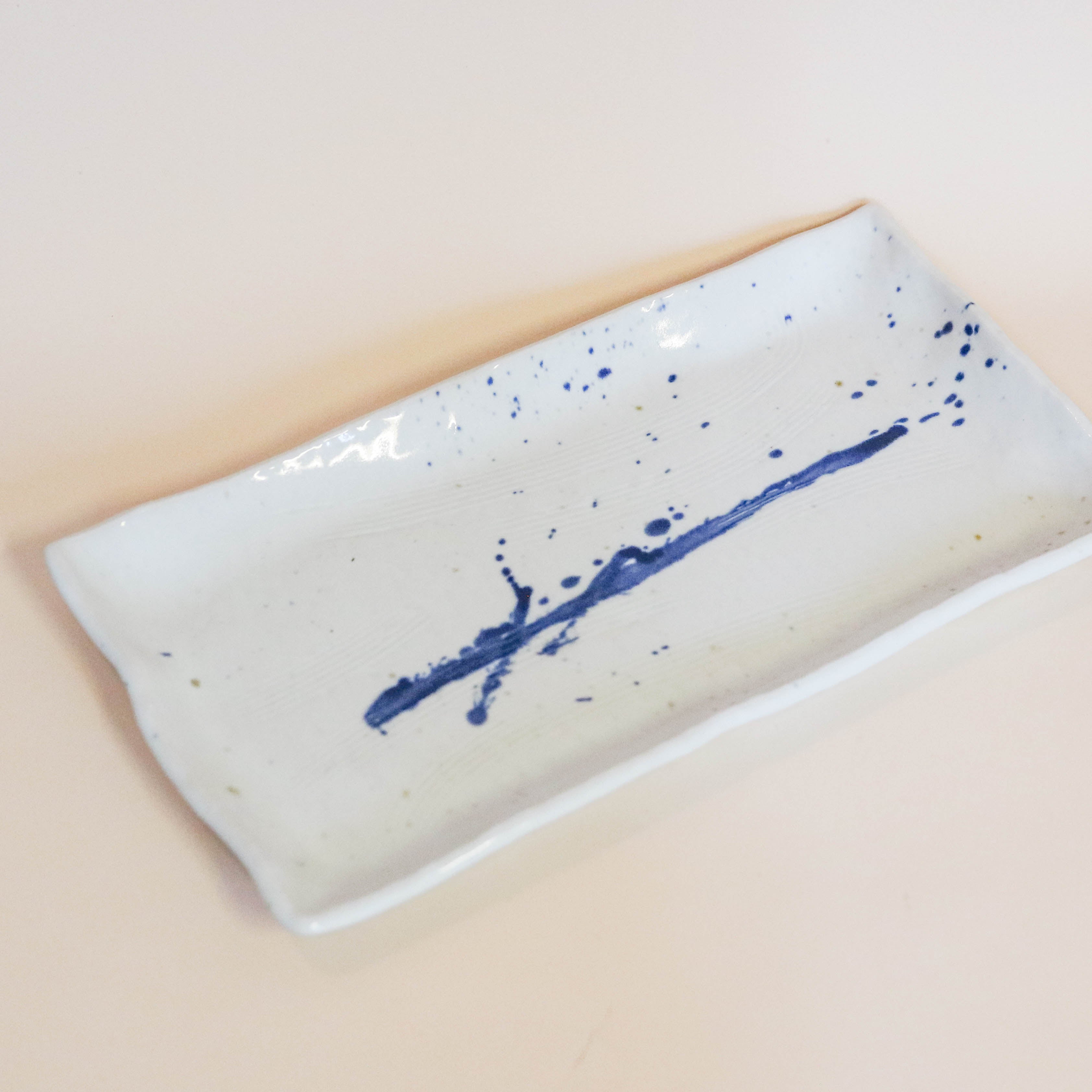 Elongated square dish with blue splash