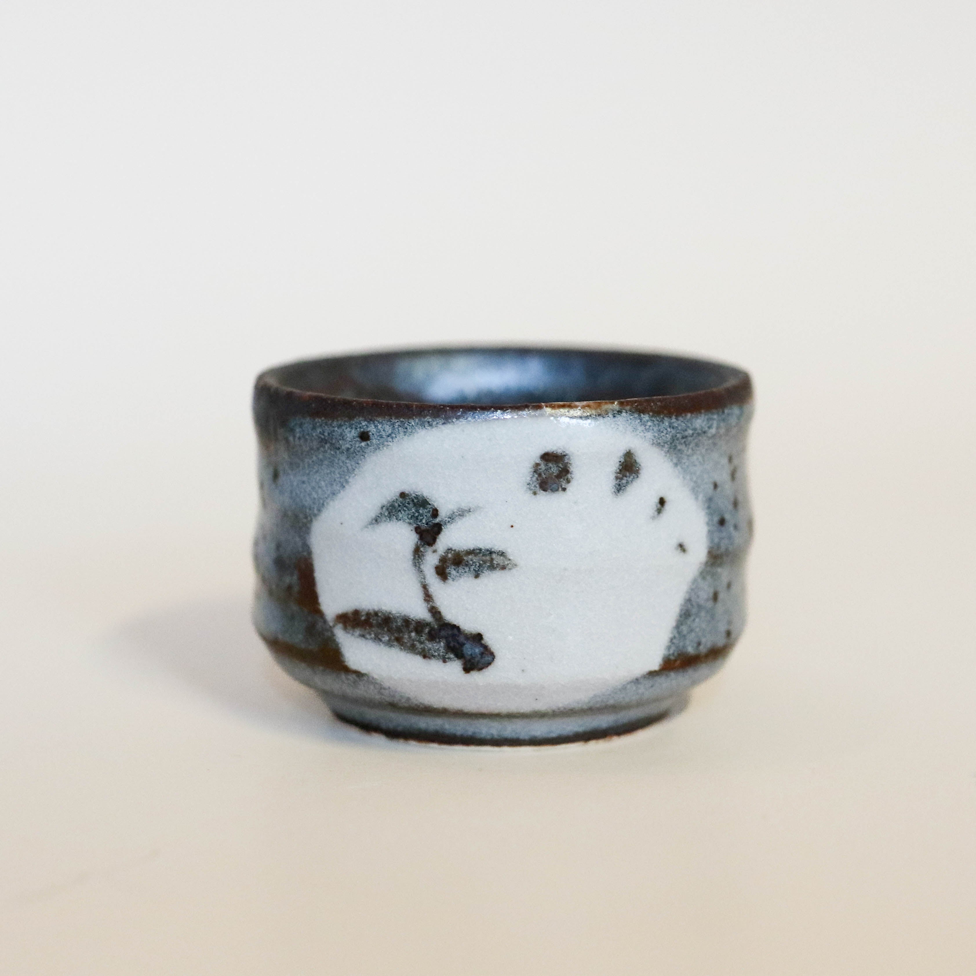 Small sake cup with gray glaze and Japanese motif