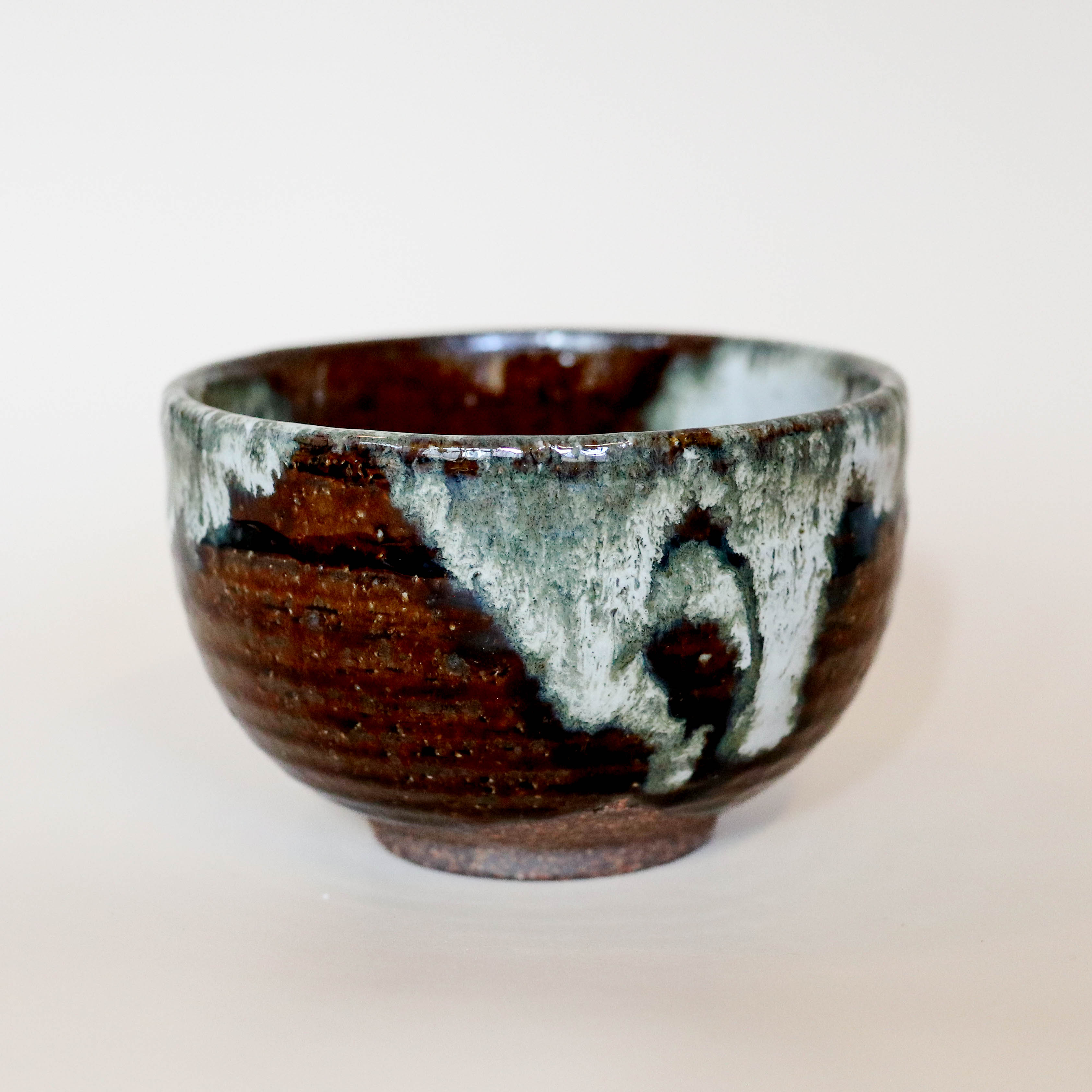 Brown bowl with continuous gray glaze