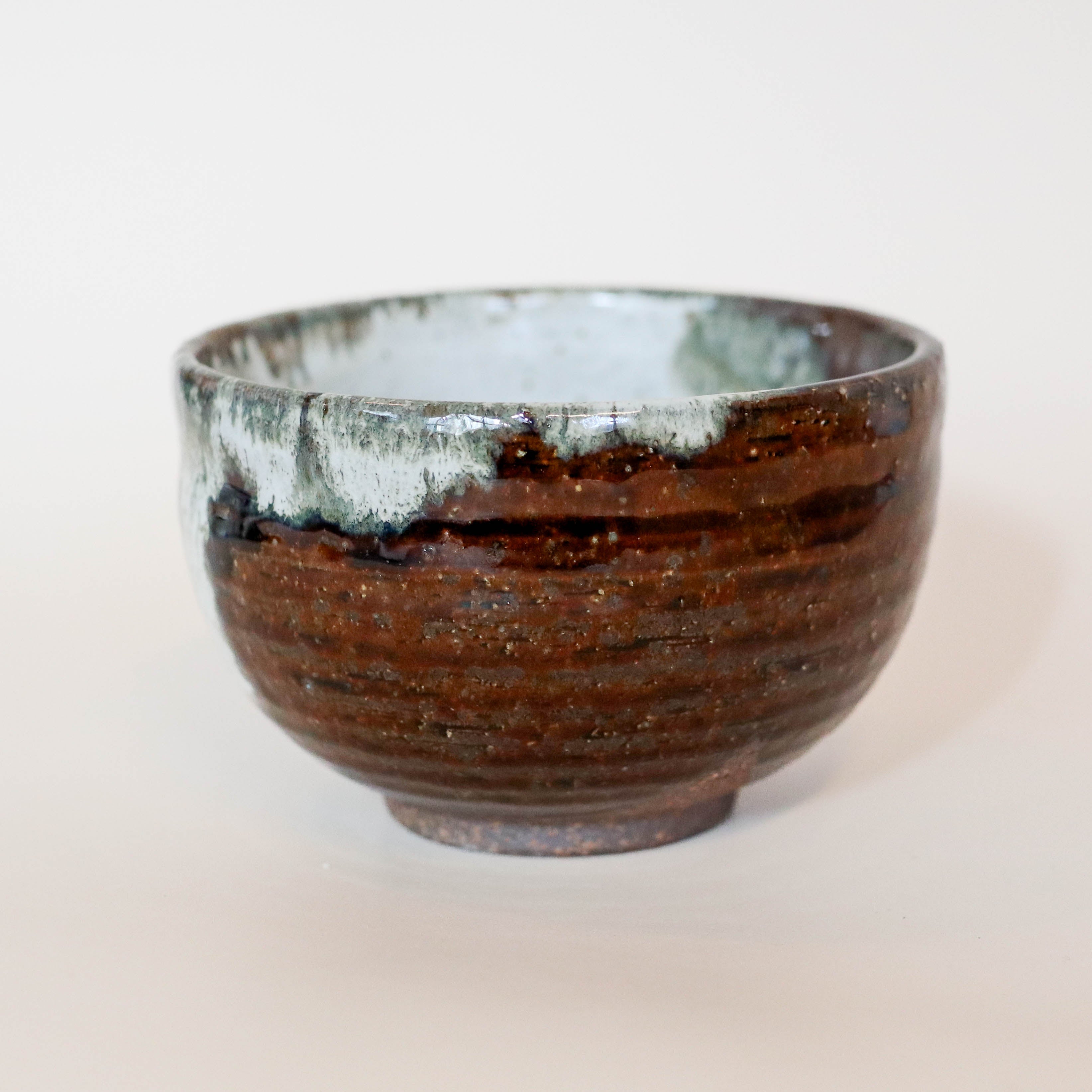 Brown bowl with continuous gray glaze