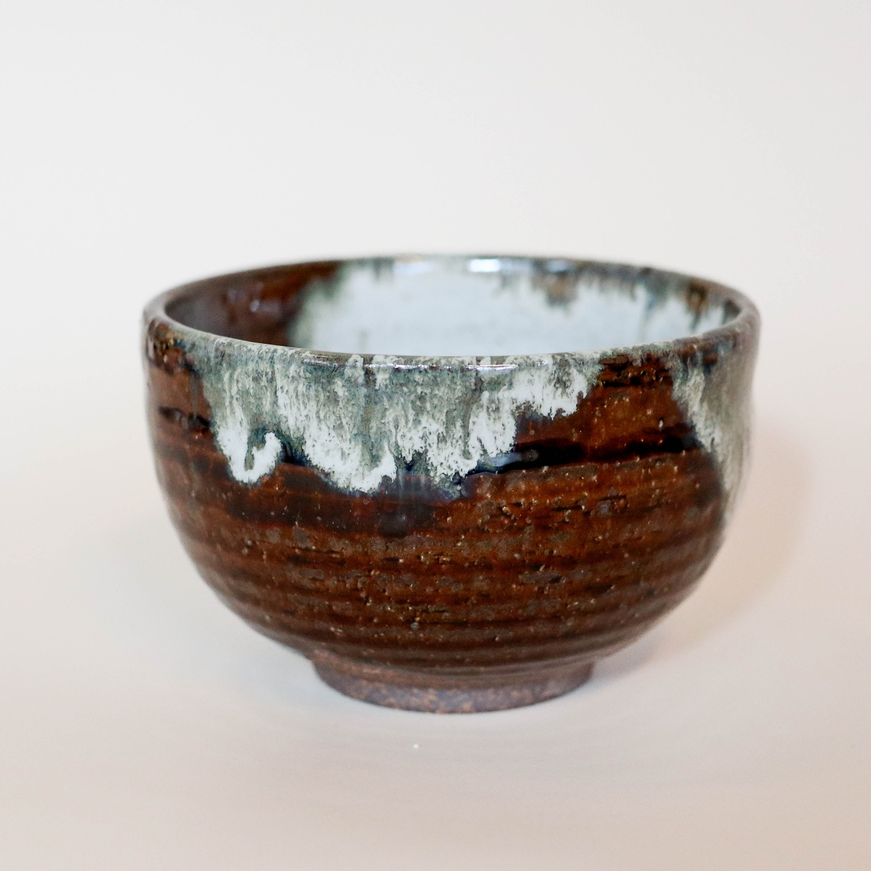 Brown bowl with continuous gray glaze