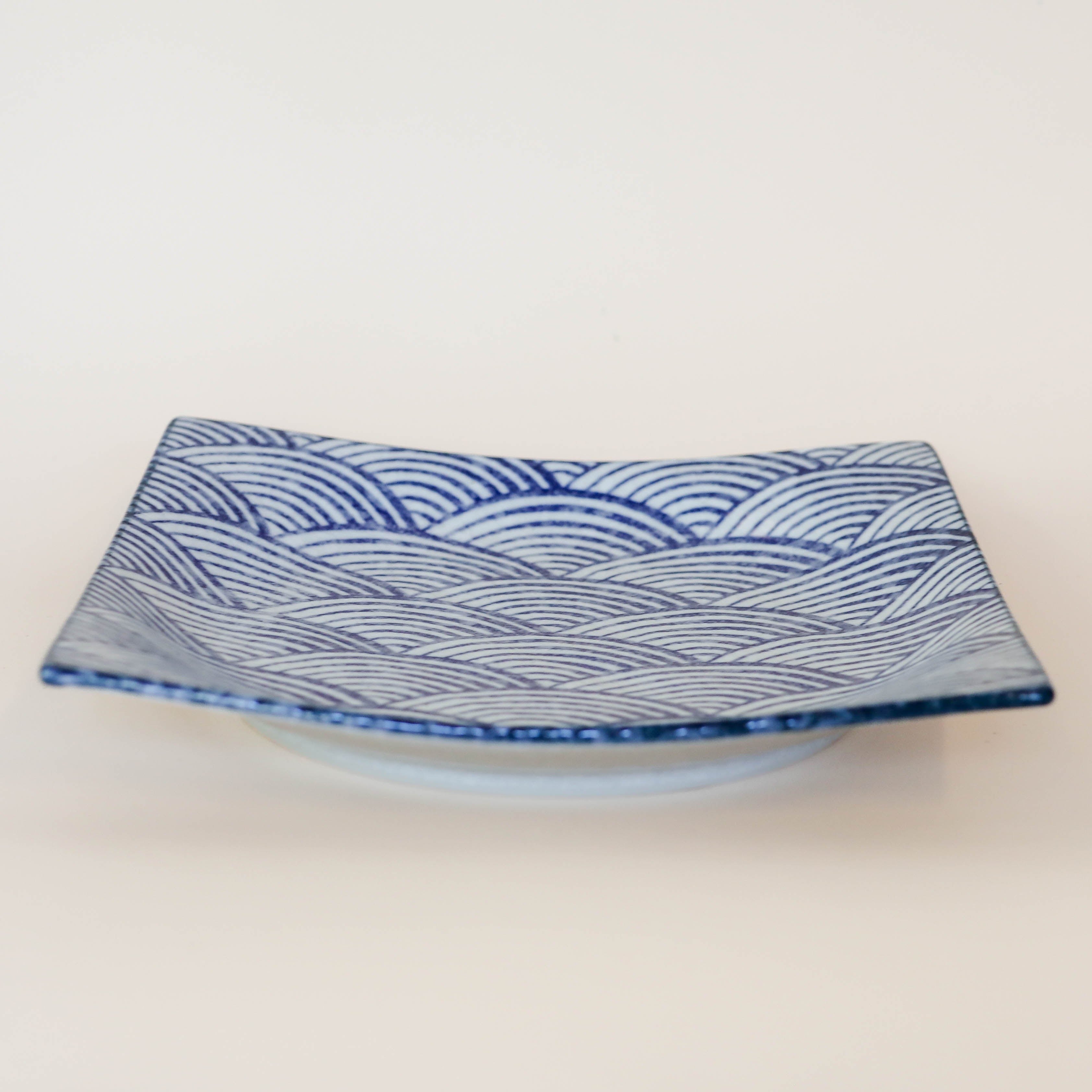 Square dish with blue waves