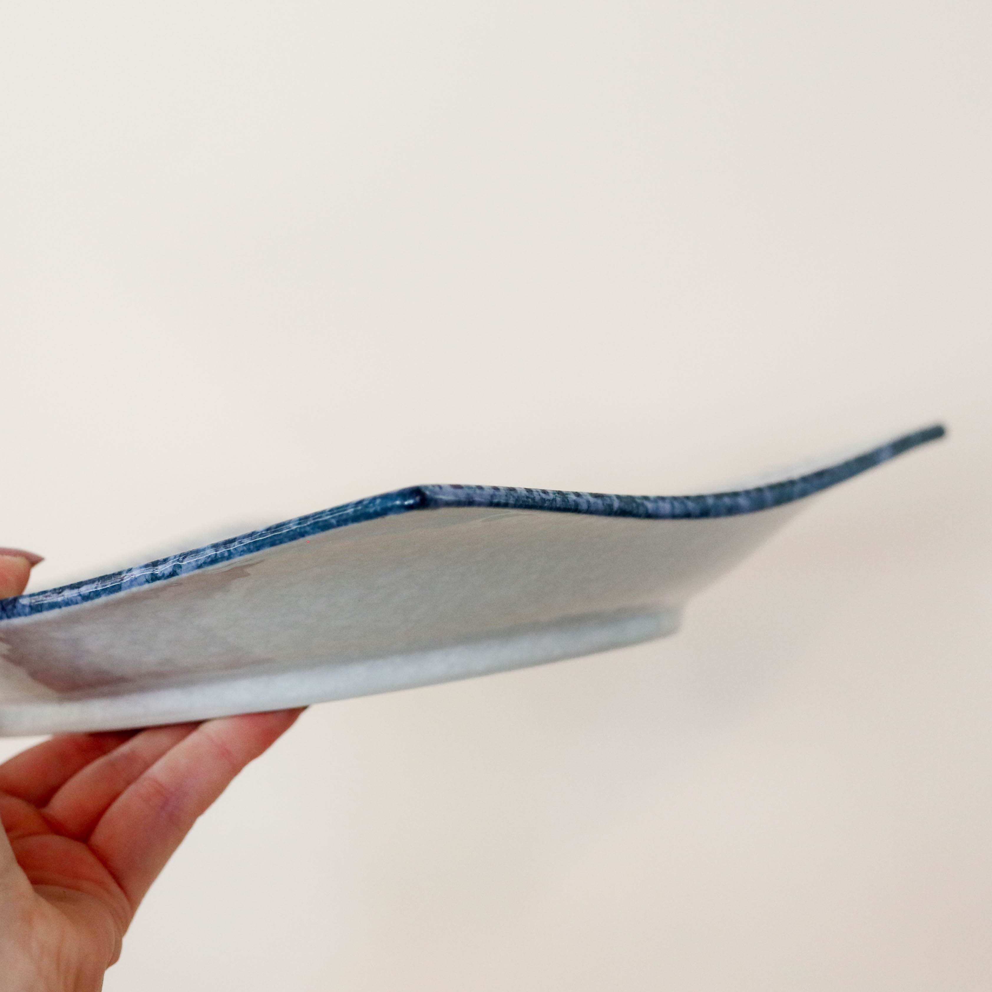 Square dish with blue waves