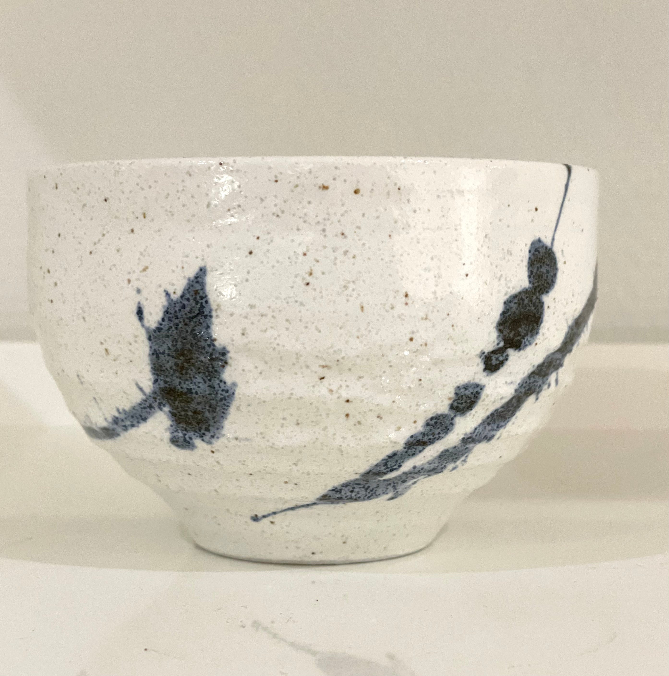 Japanese cup with blue splash pattern