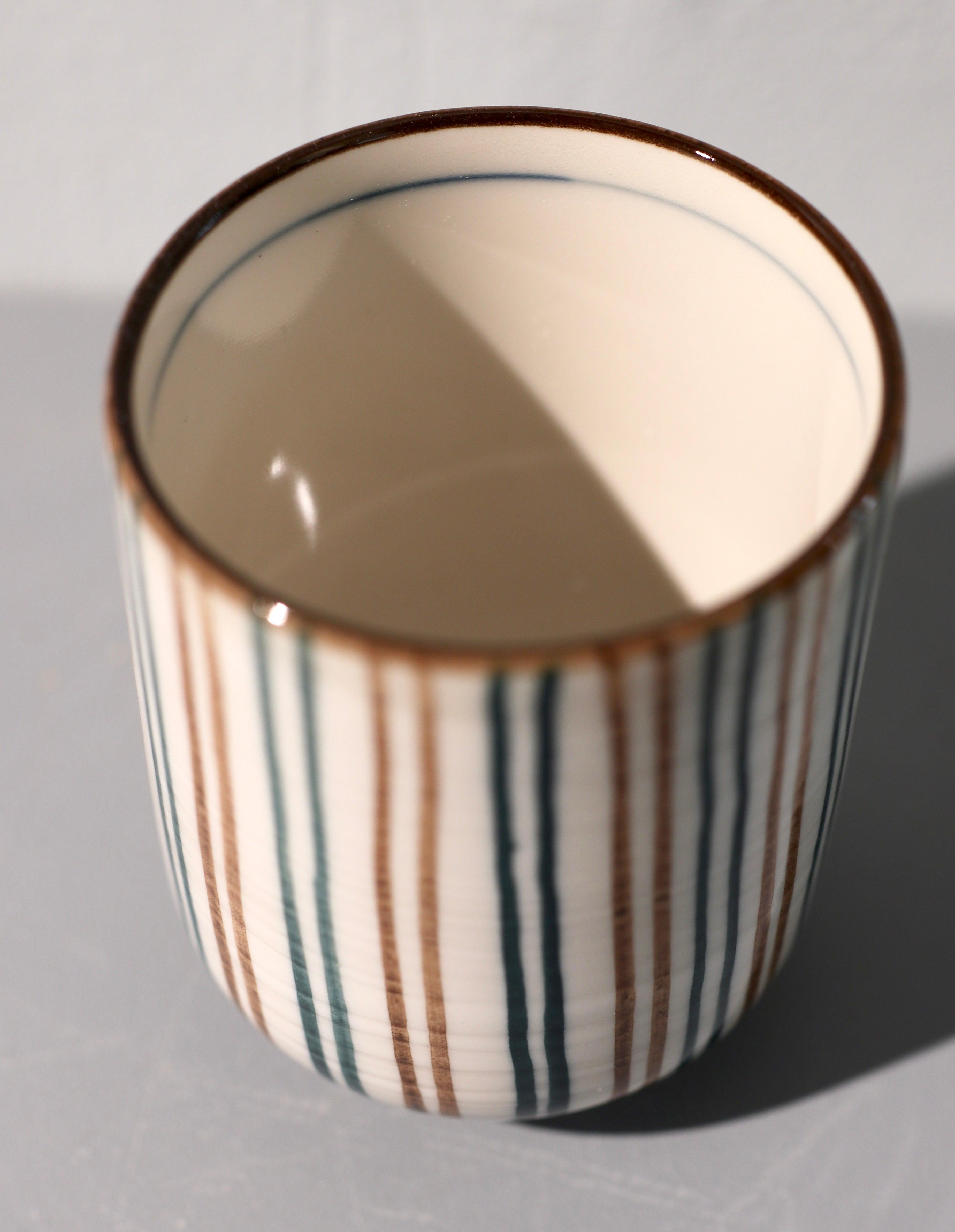 Narrow cup with brown and green stripes