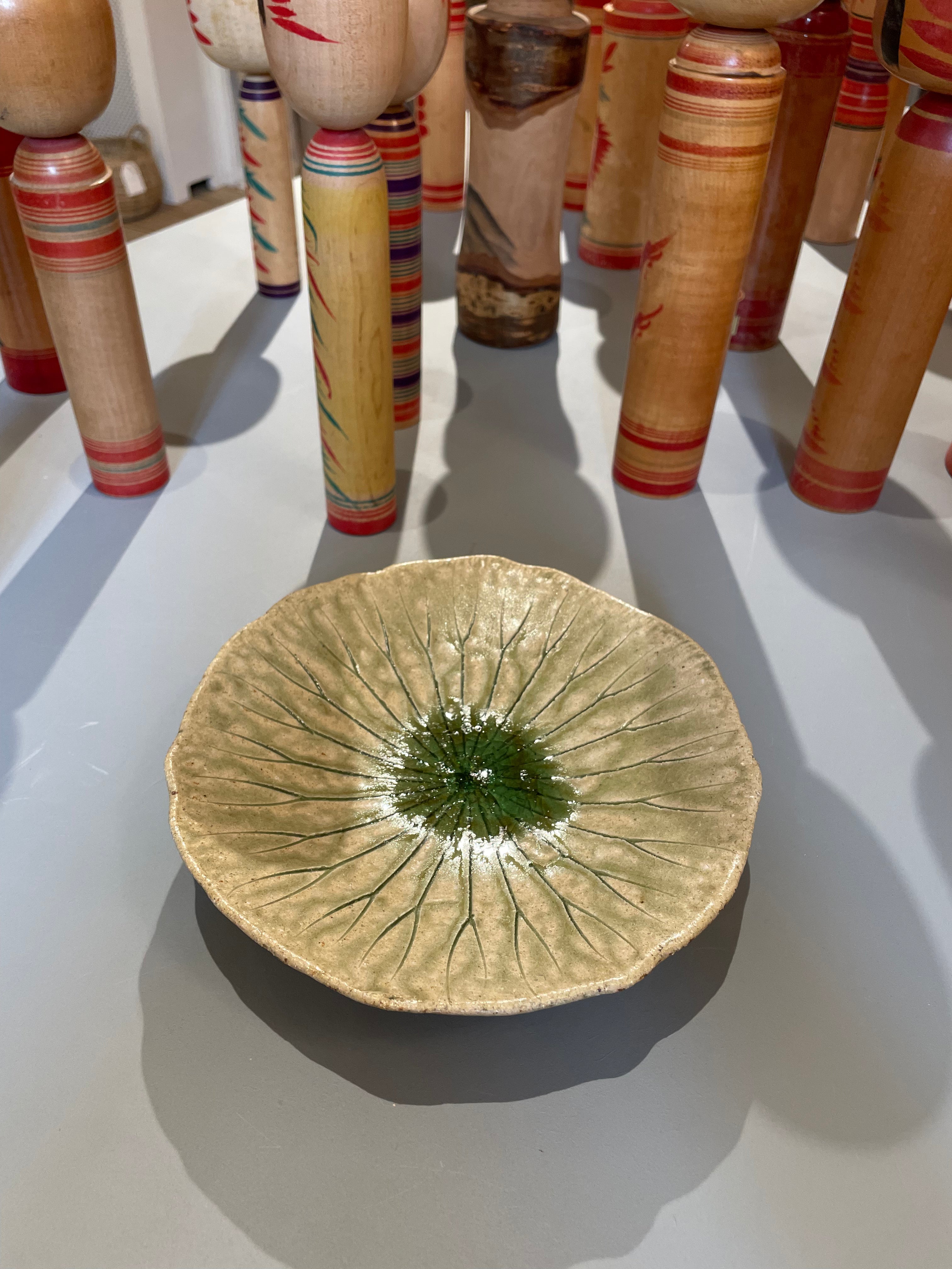 Small round dish with green leaf pattern