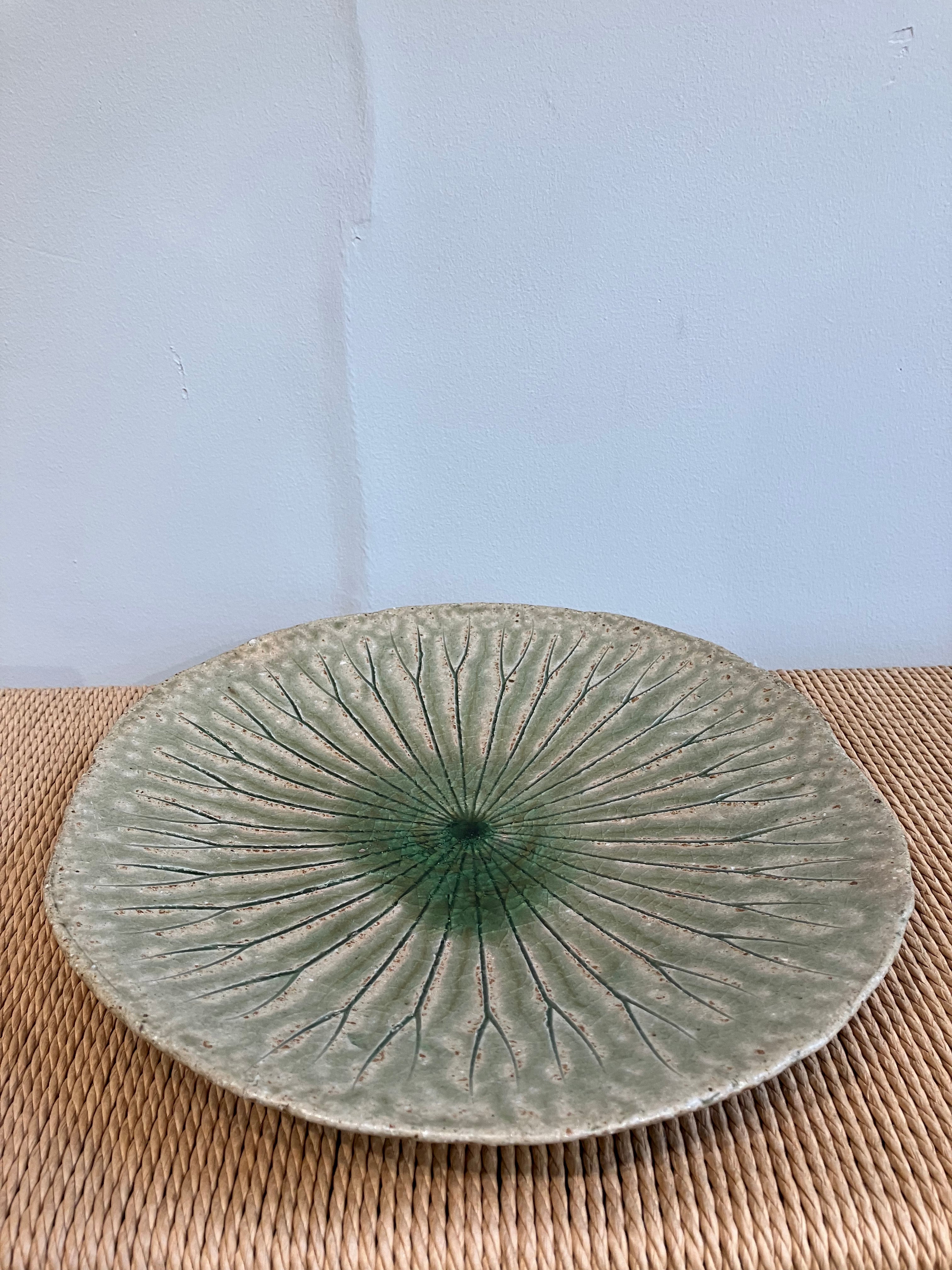 Large round dish with green leaf pattern