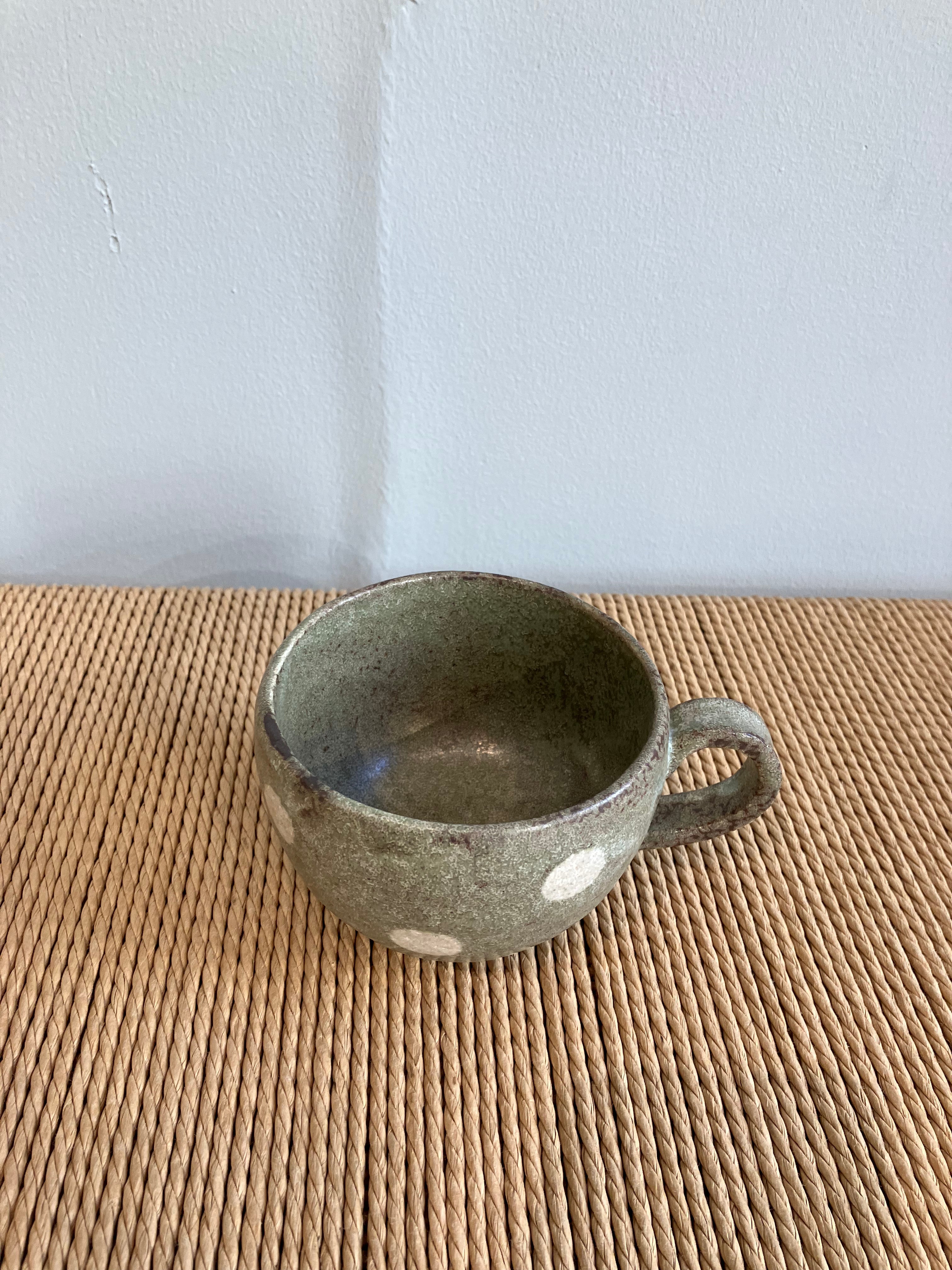 Japanese ceramic cup with green glaze and white dots