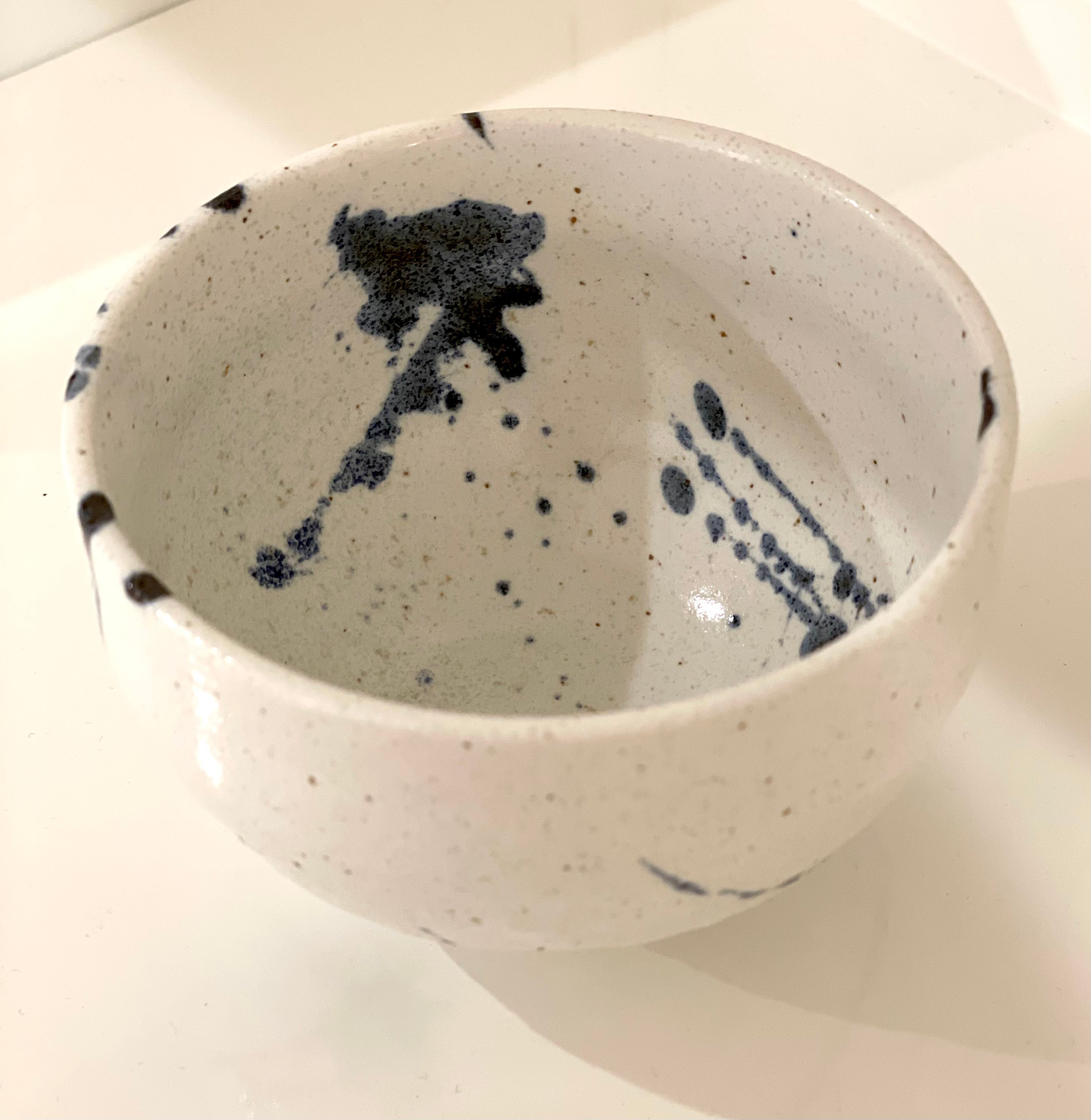 Japanese cup with blue splash pattern