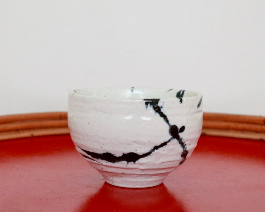 Japanese cup with blue splash pattern