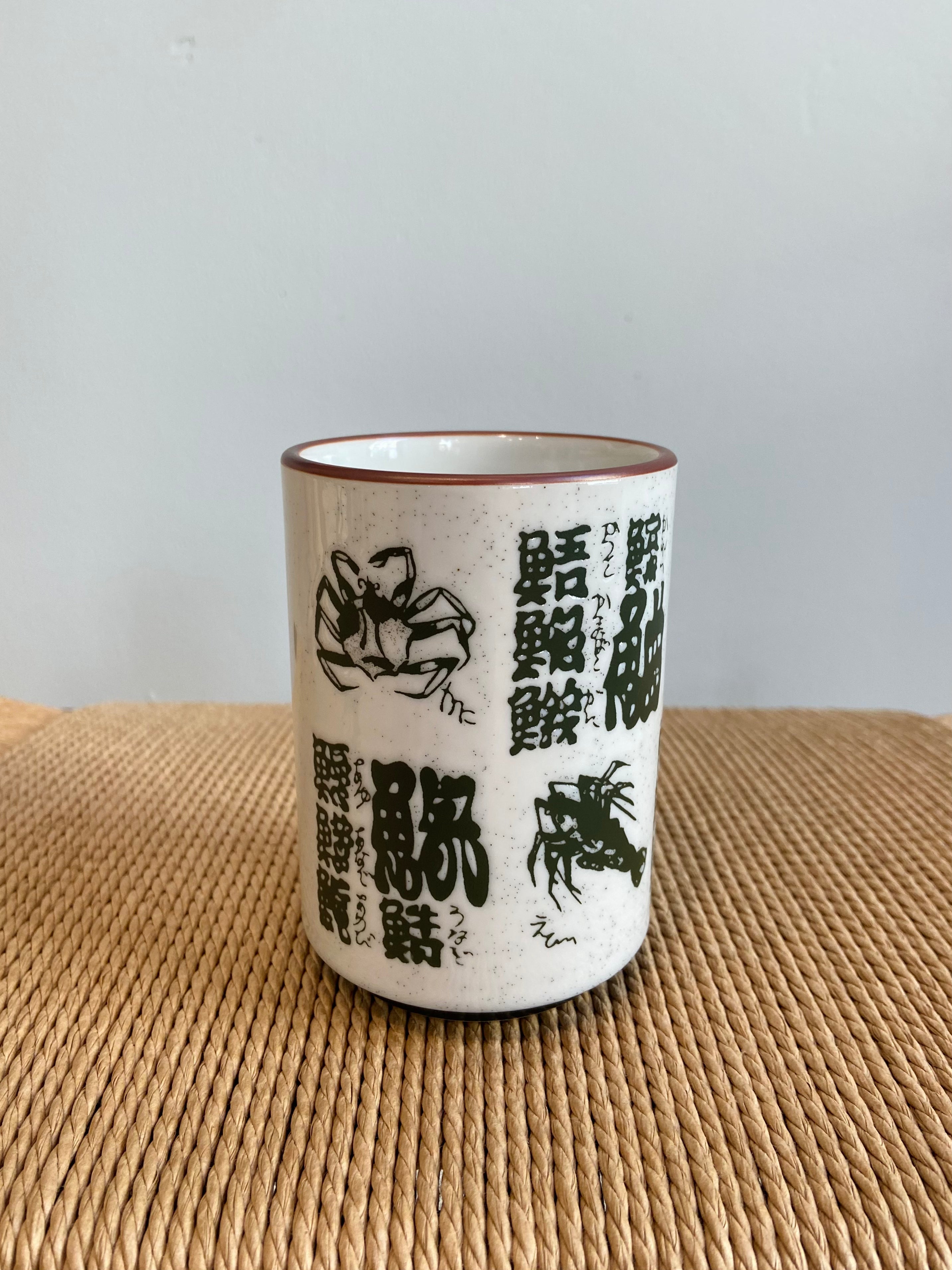 Cup with fish and Japanese motifs