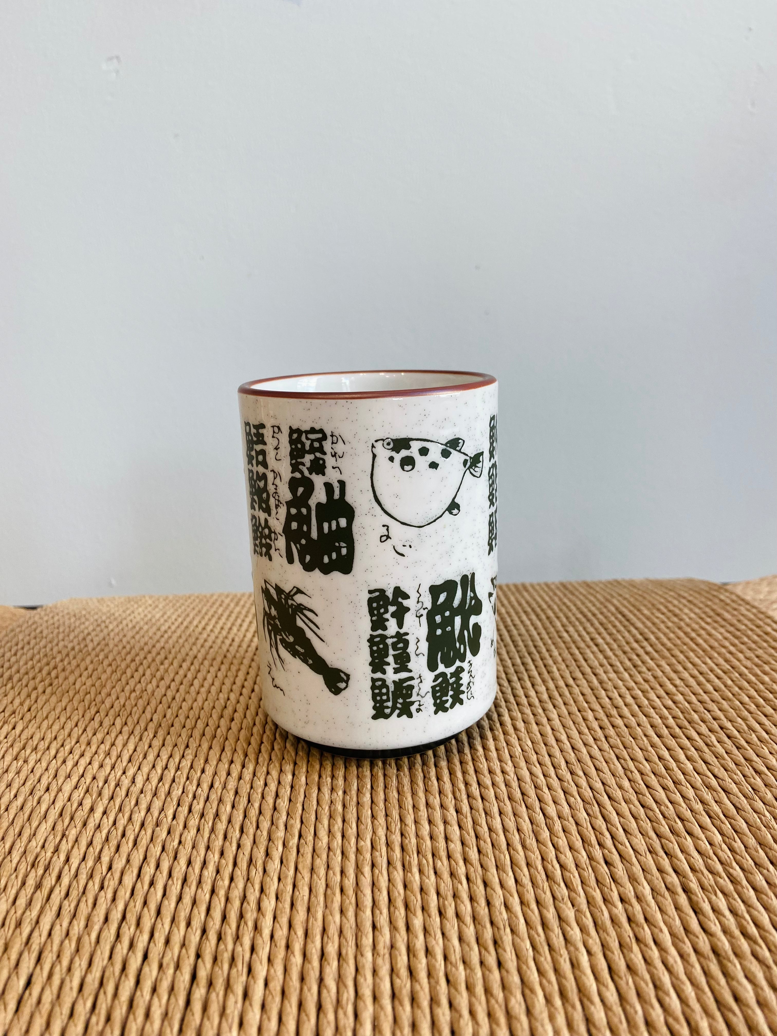 Cup with fish and Japanese motifs