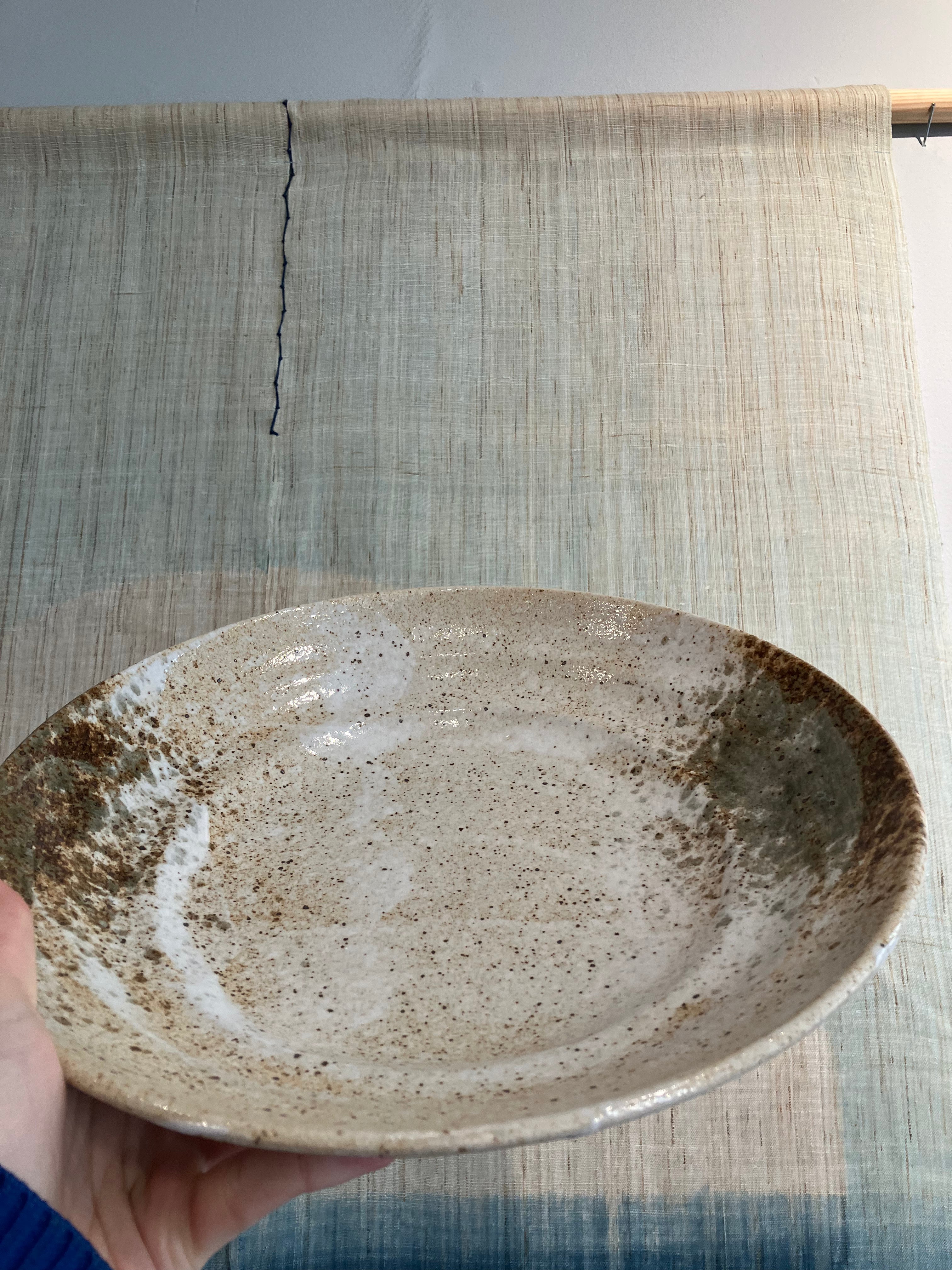 Large dish with rustic glaze in shades of brown and green