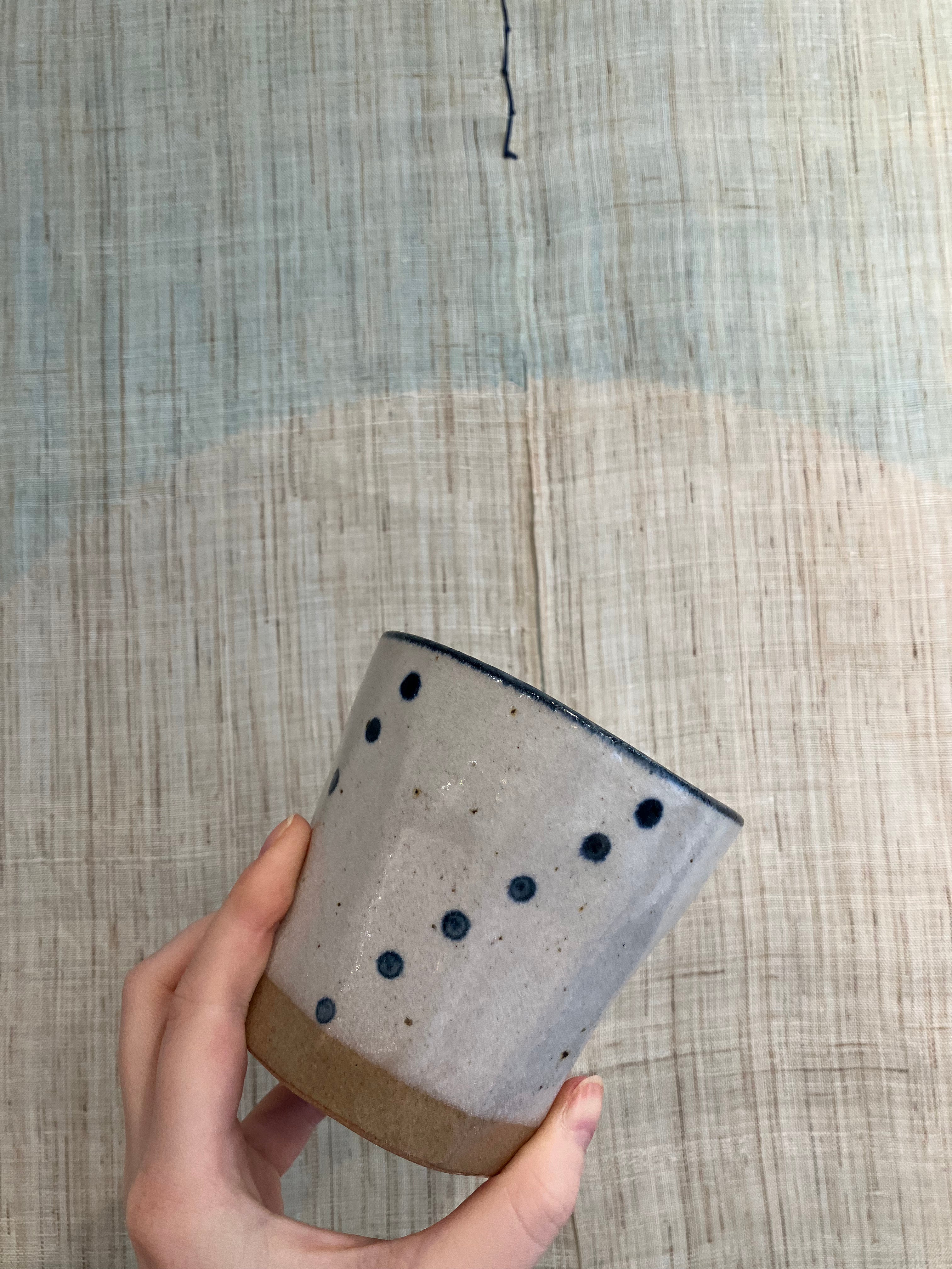 Large mug with beige glaze and blue details