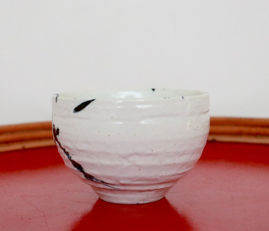 Japanese cup with blue splash pattern